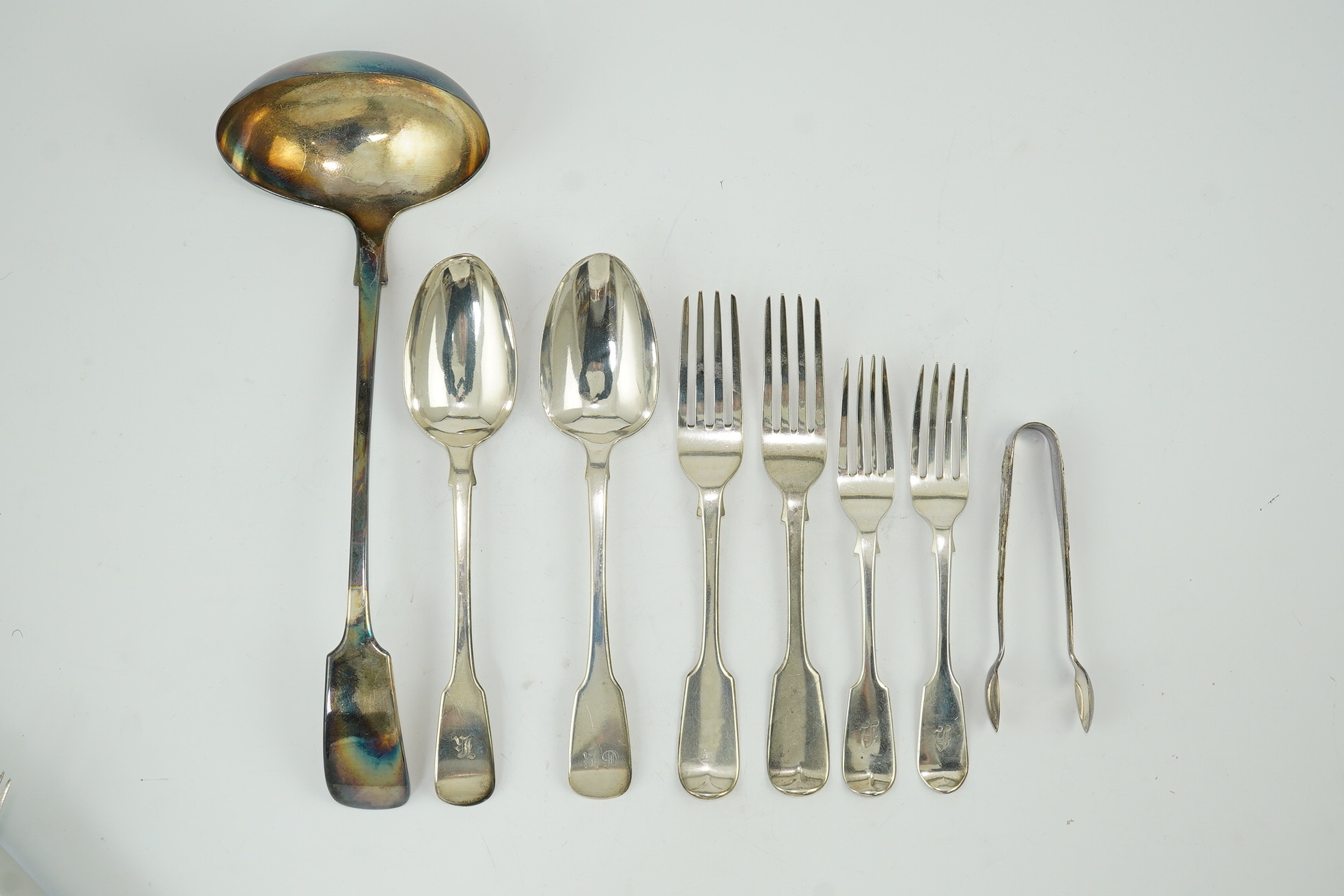 Eighteen items of assorted Victorian silver fiddle pattern flatware, various dates and makers